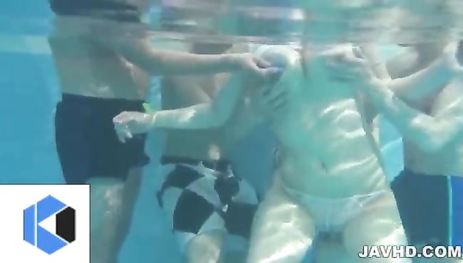 Two men make a threesome and enjoy a time with one hot babe under water